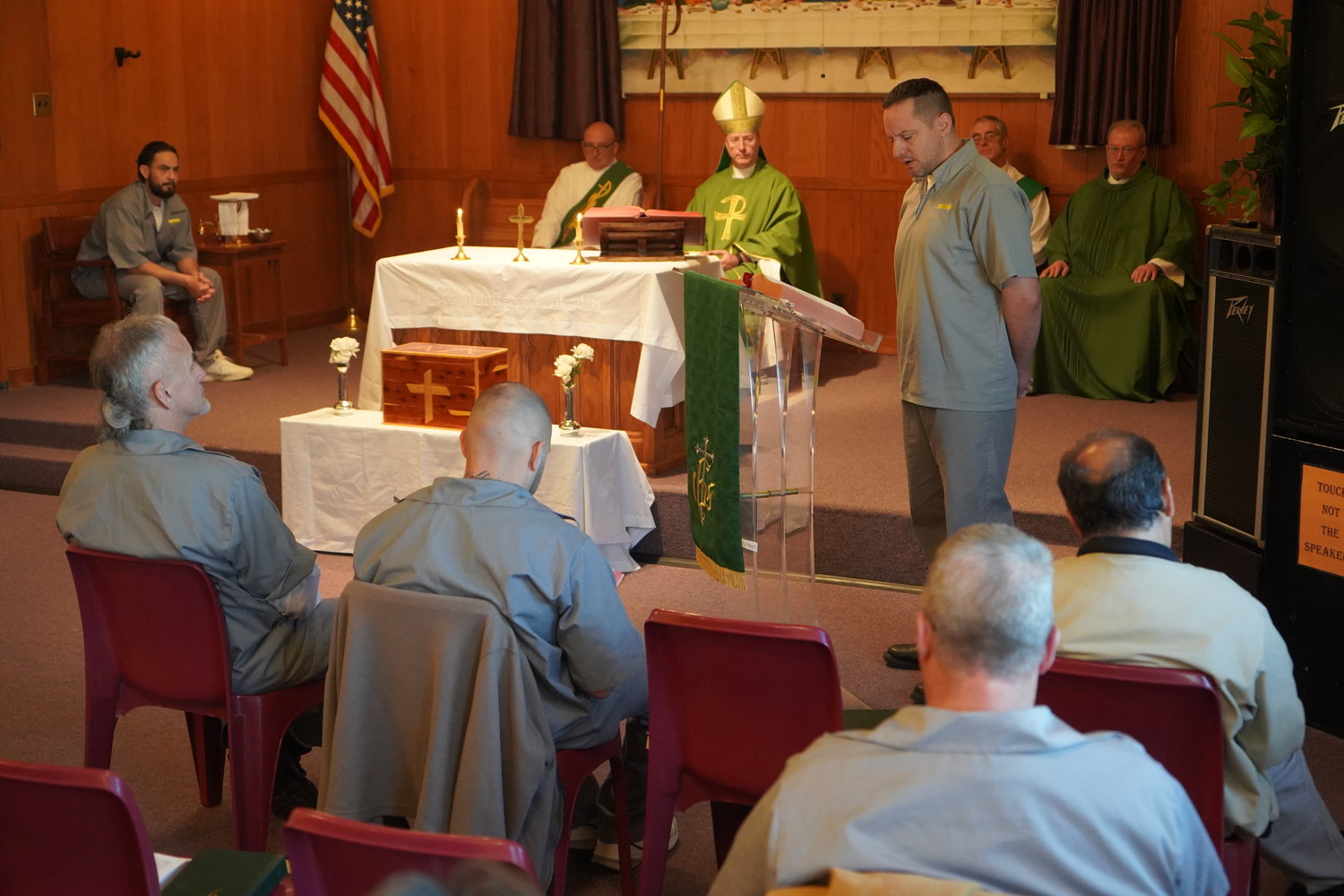 A resident of the Algoa Correctional Center in Jefferson City proclaims a reading during a Nov. 6 Mass offered by Bishop W. Shawn McKnight and Father Michael Penn in the prison chapel.